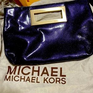 Michael Kors large vintage purple clutch bag
Michael Kors